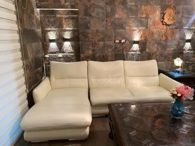 a living room with a couch and a table at الفاروق in Amman