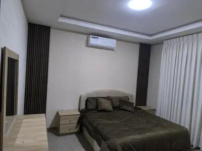 a bedroom with a bed in a room at الفاروق in Amman