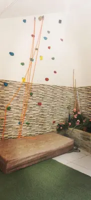 a room with a large wooden bench in front of a wall at شقة كبيرة مميزة للعائلات -مدخل مستقل in Amman