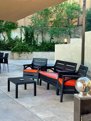 a group of benches sitting on a patio at sama vailla in Amman