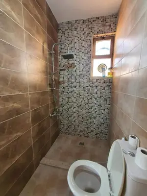 a bathroom with a toilet and a sink at sama vailla in Amman