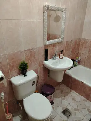 a bathroom with a toilet and a sink at العقبه in Aqaba