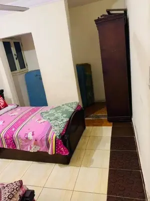 a bedroom with a bed and a dresser in a room at اهلا وسهلا في الاردن in Petra