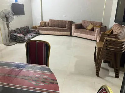 a living room with two couches and a couch at Kenda house in Ajloun