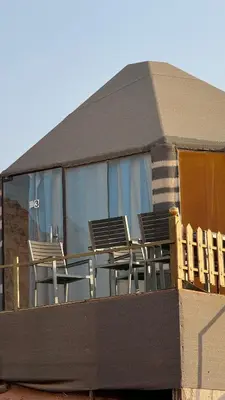 a group of chairs sitting on top of a building at LUXURY camp in Disah