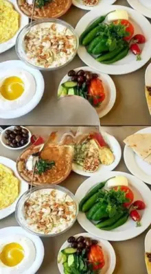 a bunch of plates of food on a table at LUXURY camp in Disah
