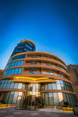 a tall building with a lot of windows at Petra Legacy Luxury in Petra