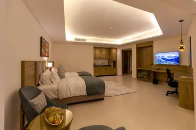 a bedroom with a bed and a living room at Petra Legacy Luxury in Petra