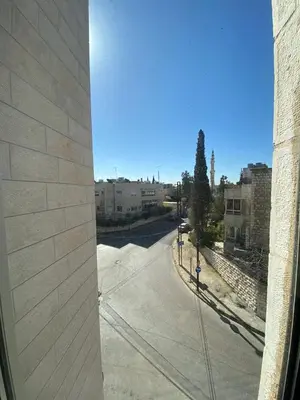 a view of a city street from a building at Studio for Rent in Jabal Alweibdeh-Amman - Jordan in Amman