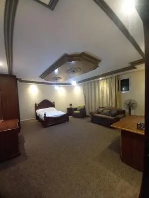a large room with a bed and a couch at Luxury furnished apartment for rent - شقة فاخرة مفروشة للإيجار in Amman