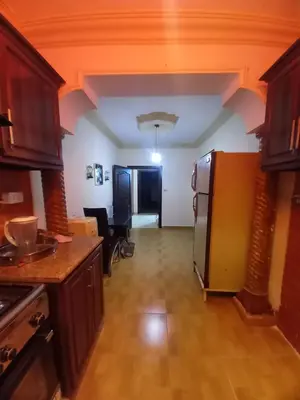 a kitchen with a stainless steel refrigerator in a room at Luxury furnished apartment for rent - شقة فاخرة مفروشة للإيجار in Amman