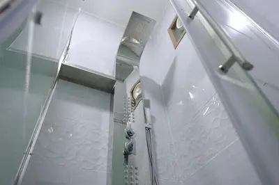 a glass shower in a bathroom with a glass door at Petra Brothers in Petra