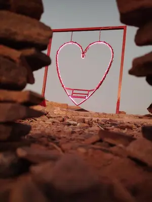 a heart on a piece of paper on a wall at مخيم علاء in Wadi Rum