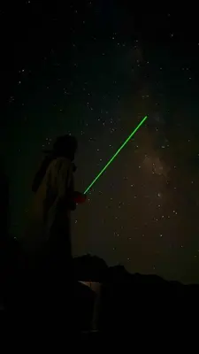 a person with a spear in the night sky at Mountain Stars Camp in Wadi Rum