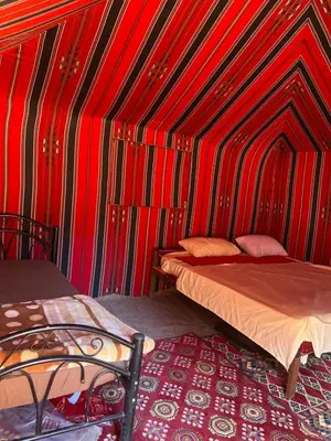 a room with two beds in a tent at Nayef camp wadi Rum in Wadi Rum