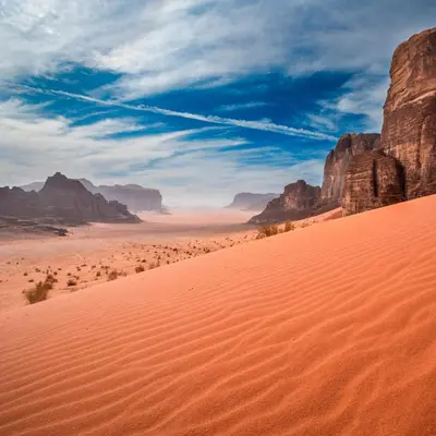 a desert scene with rocks and a blue sky at Nayef camp wadi Rum in Wadi Rum