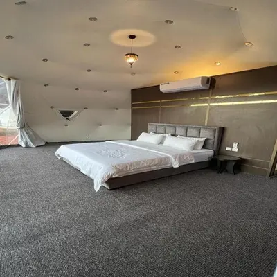 a bedroom with a large bed in a room at Super Delxue Tent in Azraq ash Shīshān