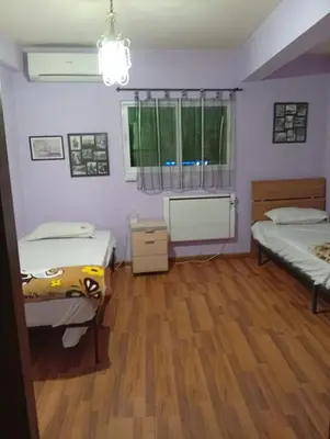 a room with two beds and a window at Monastery in Wadi Musa