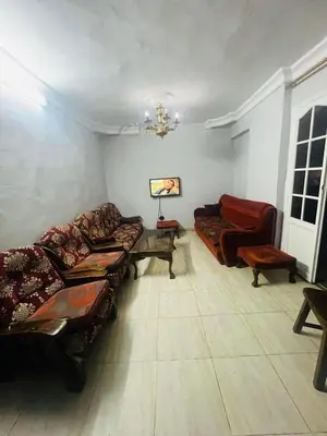 a living room with couches and a couch at Sky apartment in Amman
