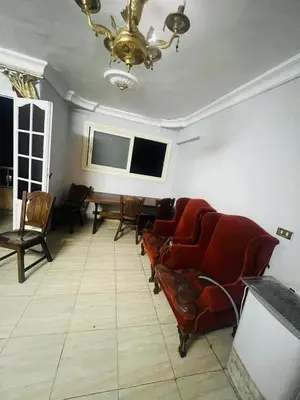 a living room with couches and a flat screen tv at Sky apartment in Amman
