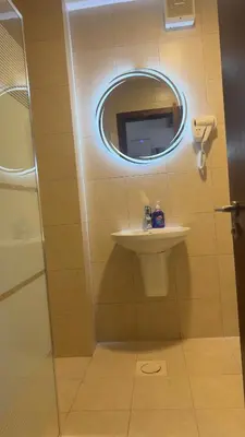 a bathroom with a sink and a mirror at قرية الراحة باطلالة بحرية-مرسى زايد-Alraha village -marsa zayed- with sea view in Aqaba