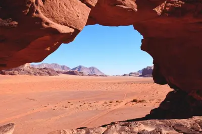 a window in a rock in the desert at Star of Rum in Disah