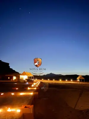 a sign that says novaulum rum at night at Nova Rum Luxury Camp in Disah