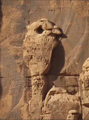 a face in the side of a rock wall at Bright Moon Luxury Camp in Wadi Rum