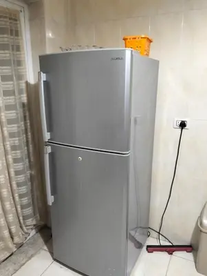 a stainless steel refrigerator in a kitchen at عمان in Amman