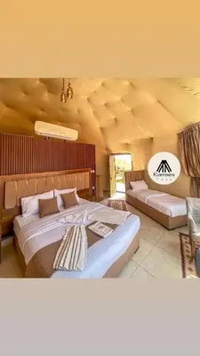 a large bedroom with two beds in it at Ramses luxury rum camp in Wadi Rum