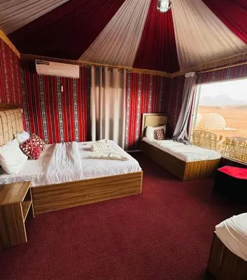 a bedroom with two beds in a tent at Ramses luxury rum camp in Wadi Rum