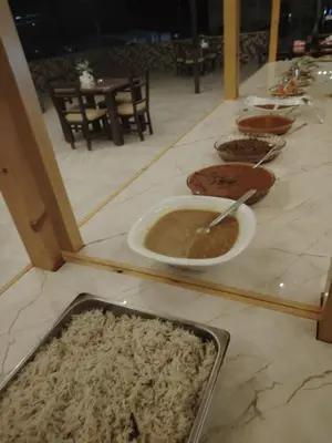 a table topped with bowls of food on a counter at Fahd Camp Wadi Rum in Wadi Rum