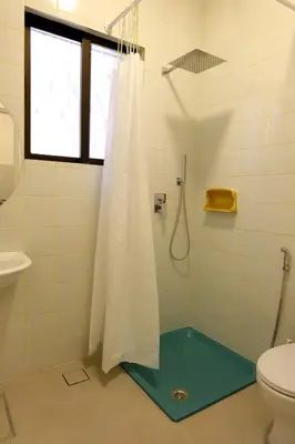 a bathroom with a shower and a toilet at Sunny Studio in Amman in Amman