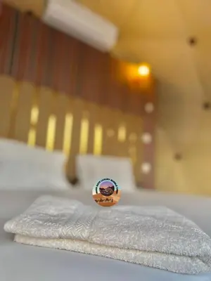 a pile of towels sitting on top of a bed at MARS GATE lUXURY BUBBLE CAMP in Wadi Rum