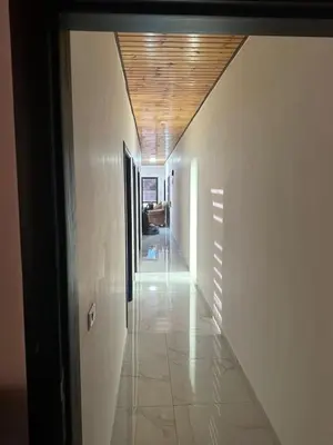 a hallway of a building with a wooden ceiling at New Rooftop 3 bedroom furnished apartment- Super deluxe in Amman