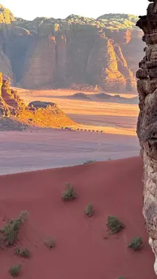 a view of a desert with mountains in the background at RUM lUXURY SAMA CAMP in Wadi Rum