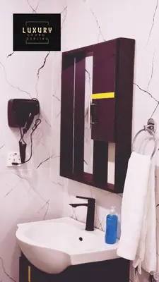a bathroom with a sink and a mirror at RUM CROWD DARLiNG LUXURY in Wadi Rum