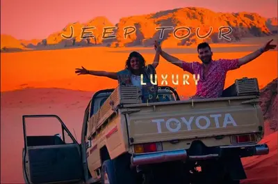 a man and woman sitting in the back of a truck at RUM CROWD DARLiNG LUXURY in Wadi Rum