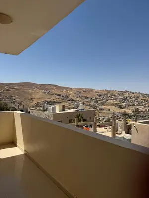 a view of a city from a balcony at Casa de petra in Wadi Musa