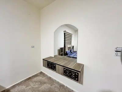 a room with a mirror on the wall at مزرعة وشاليه ادم