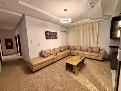a living room with a couch and a coffee table at Luxury comfortable apartment