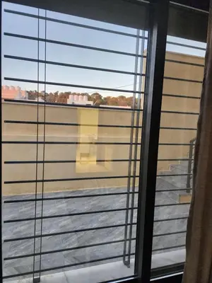 a view from a window of a balcony at 3BR Furnished Apartment for Rent - PART OF VILLA in Amman