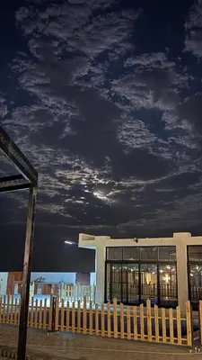 a building with a fence in front of it at Olive tree chalet and farm -مزرعه و شاليه شجره الزيتون