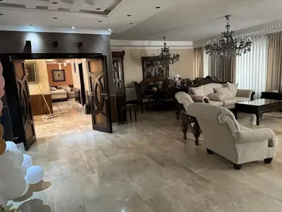 a large living room with couches and a dining room at Luxurious 5 bedroom Furnished Villa superb locationفيلا فخمه in Amman