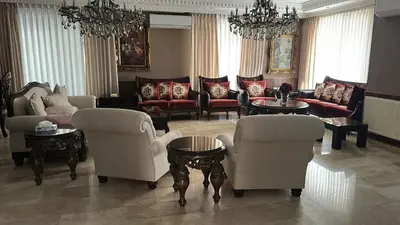 a living room with couches and chairs and tables at Luxurious 5 bedroom Furnished Villa superb locationفيلا فخمه in Amman