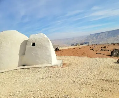 a small building in the middle of the desert at Tootya camp