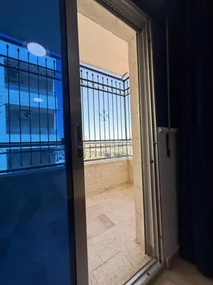 a glass door with a view of a balcony at 3bedroom aprt of 200sqm near movenpick hotel amman in Amman