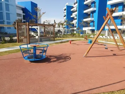 an empty playground with a slide and a swing at Ayla-Azure in Aqaba