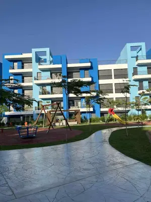 a playground in front of a large apartment building at Ayla-Azure in Aqaba