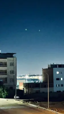 a group of buildings and a street light in a city at Jordan house in Al Bāriḩah